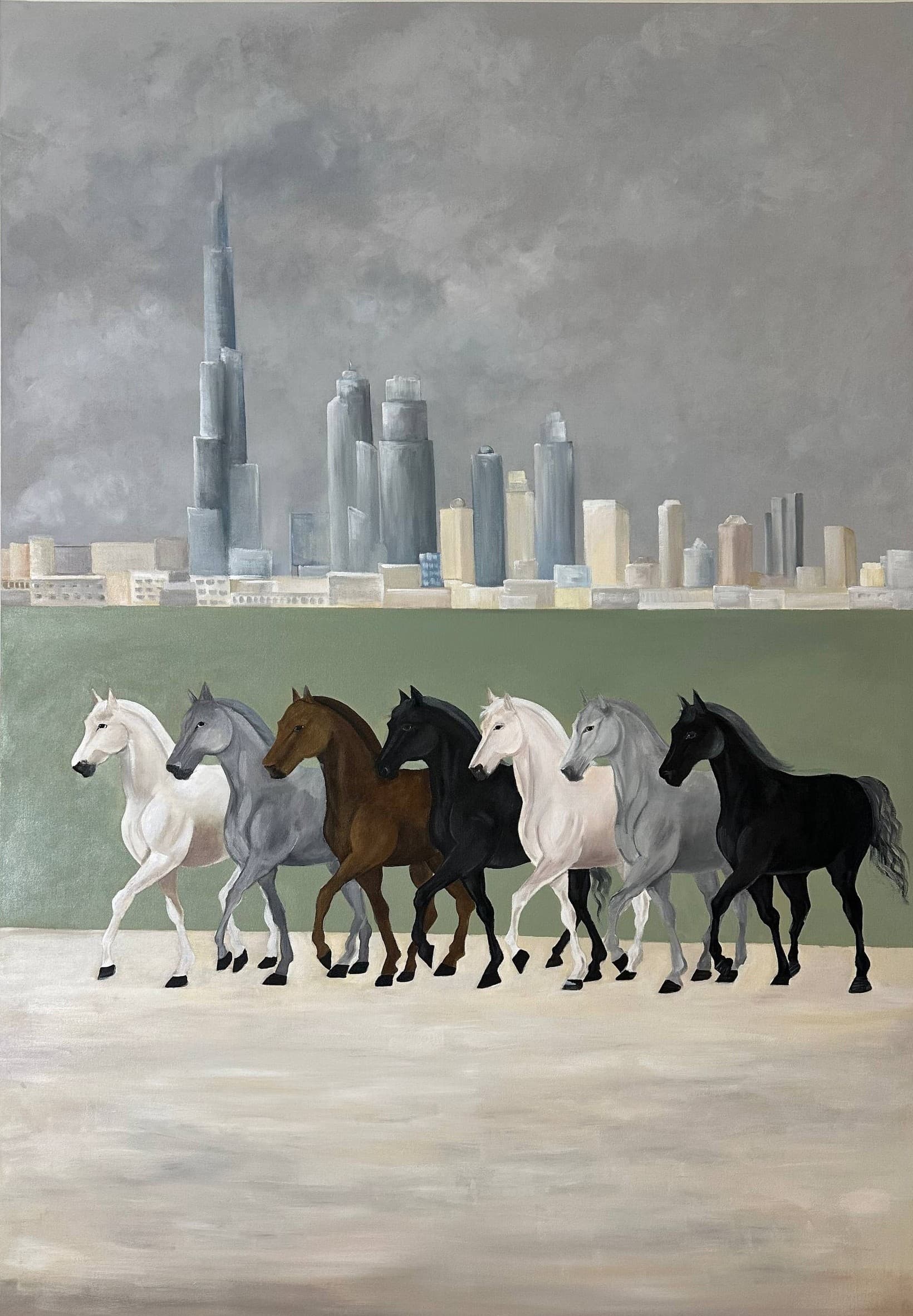 Seven horses walking in a line across pale sand, in white, grey, chestnut and black. Behind them a flat green band, and above that the Dubai skyline under heavy grey cloud.